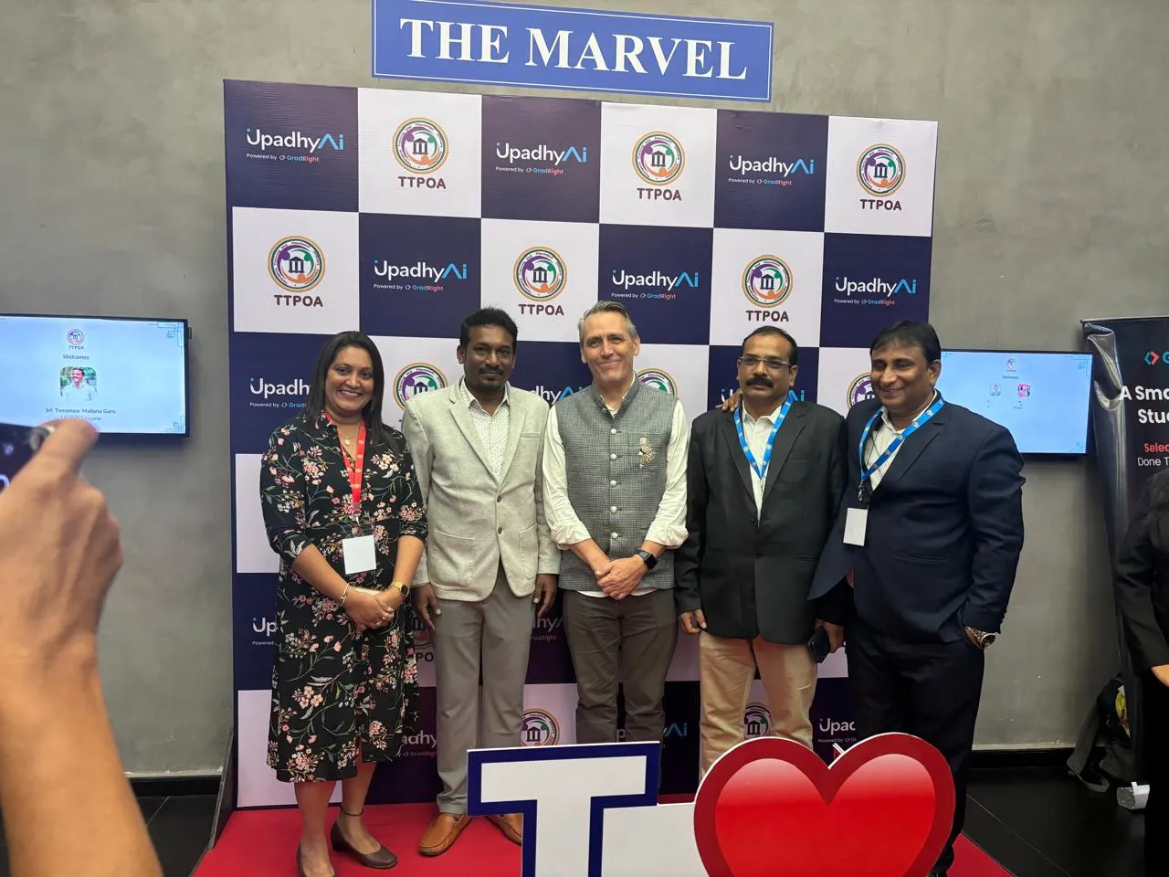 Guests at the TTPOA summit photo wall