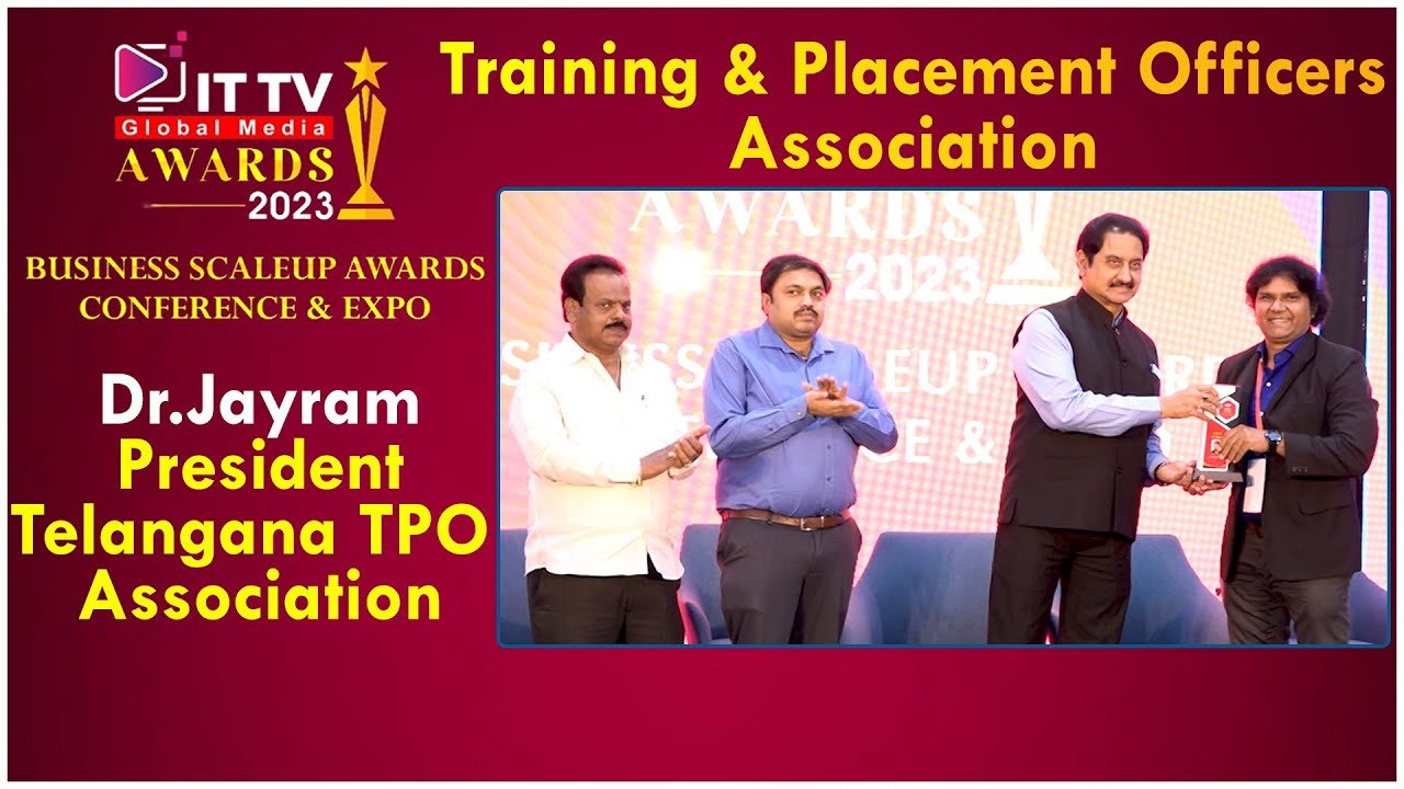 Dr. Jayaram receiving an award on stage